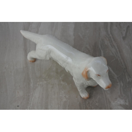 600 - A Belleek pottery Irish Setter dog.