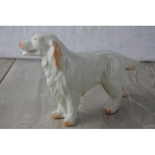 600 - A Belleek pottery Irish Setter dog.