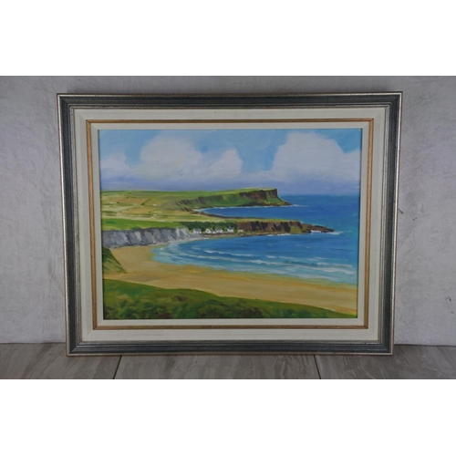 604 - A framed painting of White Park Bay, signed by the Artist.  Approx 50x39cm.