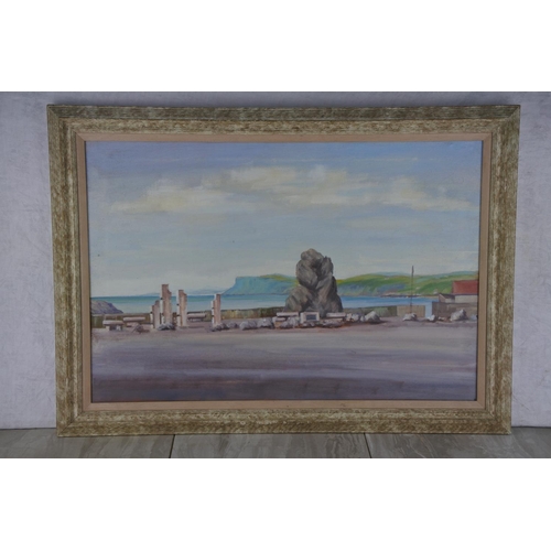 605 - A framed painting of Ballycastle harbour, signed by the Artist.  Approx 71x51cm.