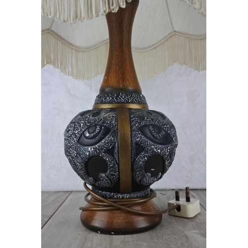 610 - A large pottery based table lamp and shade.  Approx 70cm.