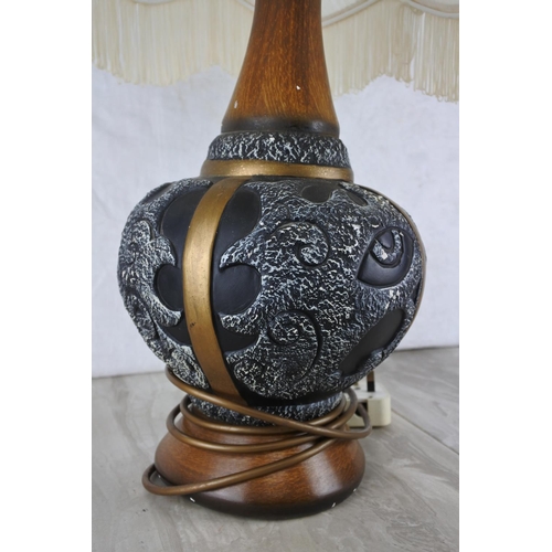 610 - A large pottery based table lamp and shade.  Approx 70cm.