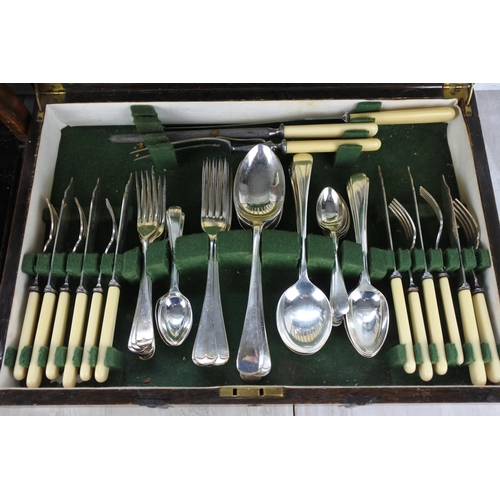 611 - A stunning antique oak cased canteen of cutlery by Joseph Rodgers & Sons and another.