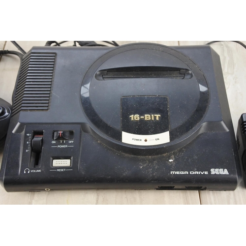 614 - A Sega Mega Drive with controllers.