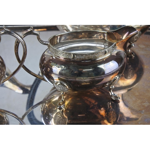 630 - A stunning four piece silver plated tea service and tray.