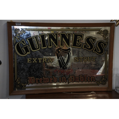 634 - A vintage style Guinness pub mirror. (frame in need of some restoration)