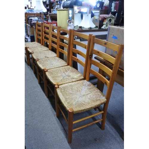 662 - A set of six pine framed dining room chairs with rattan seats.