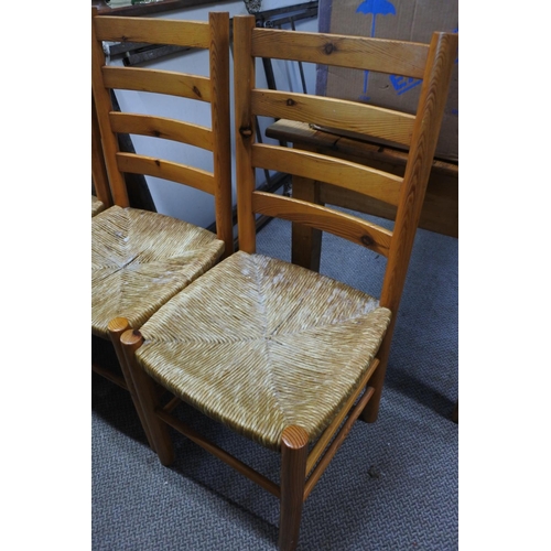 662 - A set of six pine framed dining room chairs with rattan seats.