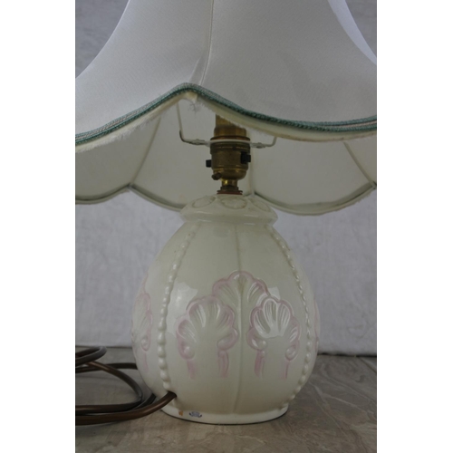 679 - A Belleek pottery table lamp base and shade.  Approx 45cm.