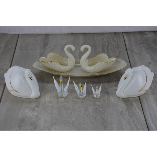 680 - A collection of swan ornaments and a dish.