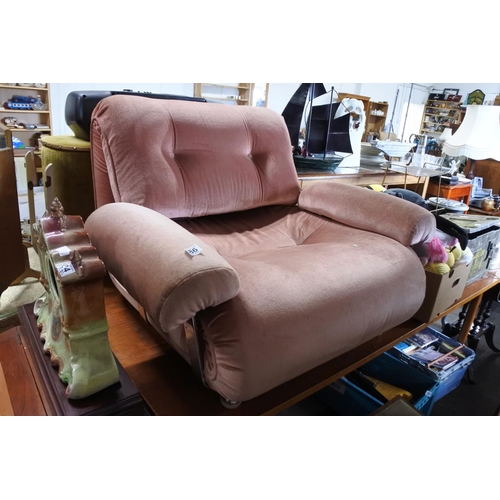 686 - A vintage upholstered lounge chair.