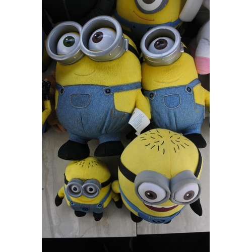 689 - A box of assorted soft toys to include Despicable Me 2 characters and more.