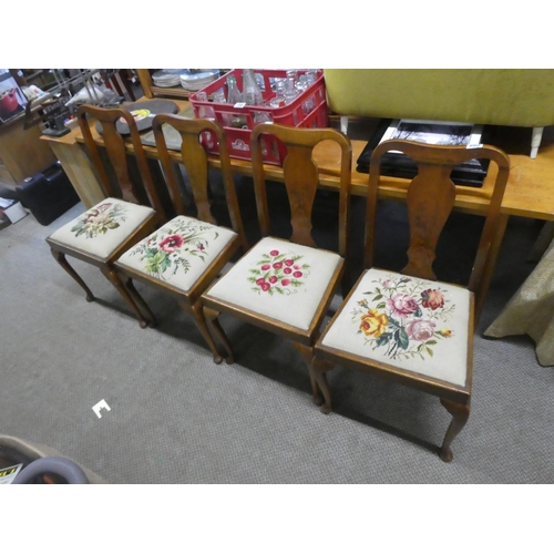 705 - A stunning set of four mahogany framed chairs with tapestry upholstered seats.