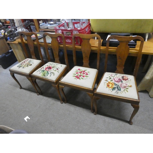 705 - A stunning set of four mahogany framed chairs with tapestry upholstered seats.