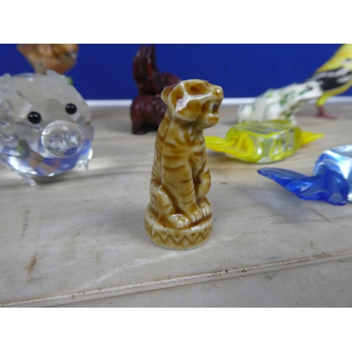 718 - A collection of animal figures, glass sweets and more.