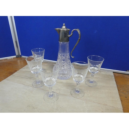 719 - A stunning claret jug and a set of five wine glasses.