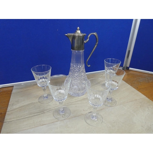 719 - A stunning claret jug and a set of five wine glasses.