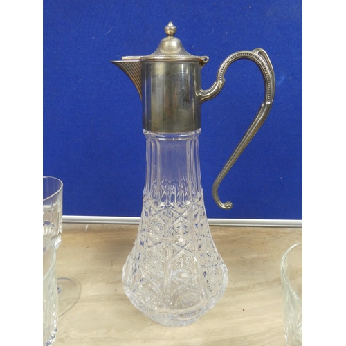 719 - A stunning claret jug and a set of five wine glasses.