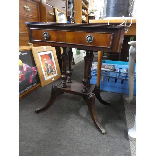 723 - A small mahogany table (missing a caster).  Approx 59x57x40cm.