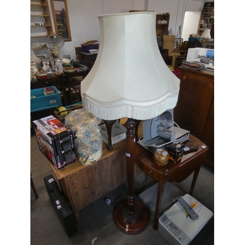 727 - A mahogany standard lamp and shade.  Approx 167cm.