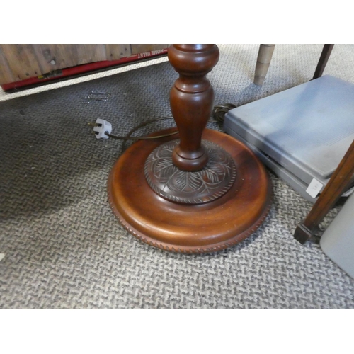 727 - A mahogany standard lamp and shade.  Approx 167cm.