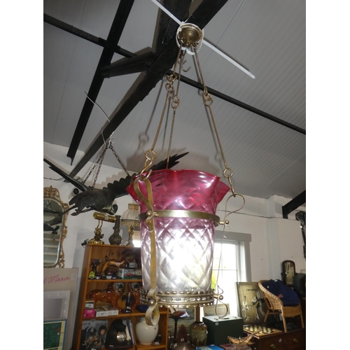 743 - A stunning antique ruby glass shade pendant light on  brass bracket.