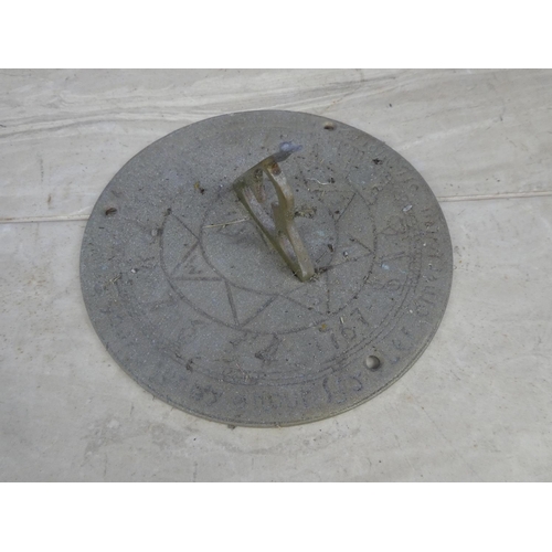 746 - A brass sundial.  Approx 18cm dia.