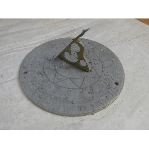 746 - A brass sundial.  Approx 18cm dia.