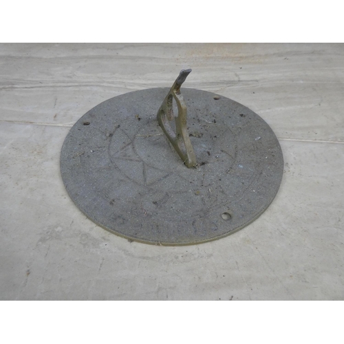 746 - A brass sundial.  Approx 18cm dia.