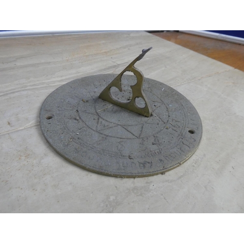 746 - A brass sundial.  Approx 18cm dia.