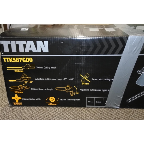 756 - A boxed Titan garden multi tool.