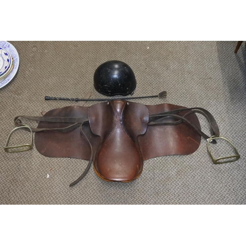 760 - A Jockey Skull cap/helmet 54/55cm and a pony saddle.