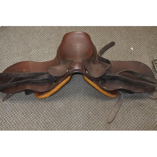 760 - A Jockey Skull cap/helmet 54/55cm and a pony saddle.