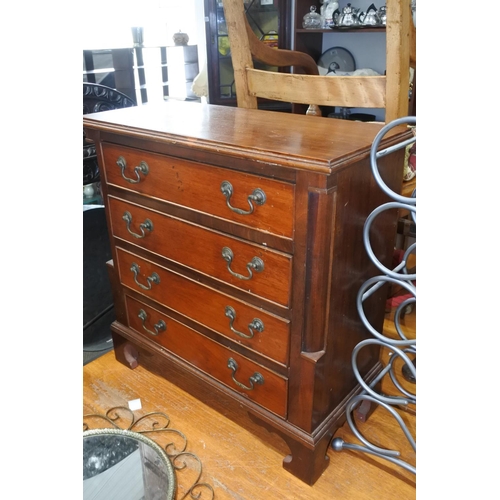 767 - A stunning small chest of four drawers.  Approx 58x59x27cm.