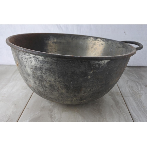 768 - A large handled bowl.