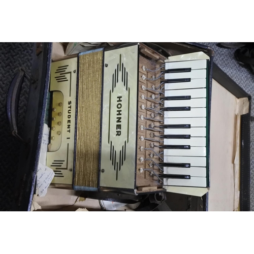 769 - A vintage Hohner Student 1 accordion and case.