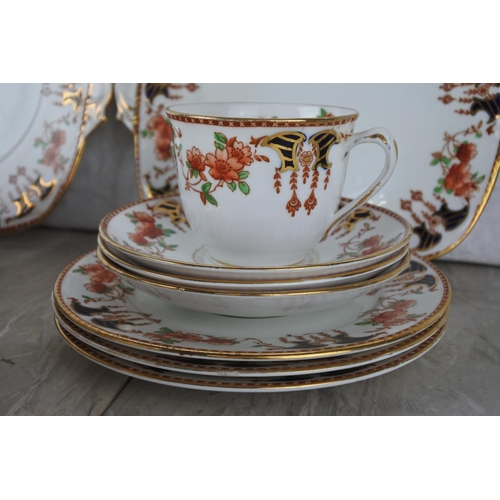 771 - A Staffordshire bone china tea set including two cake plates.