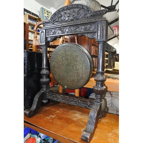 772 - A stunning antique painted oak floor standing gong with carved detail.  Approx 64x98x38cm.