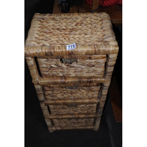 775 - A rattan four drawer storage unit.  Approx 37x80x30cm.