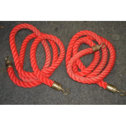 777 - Two que barrier ropes.