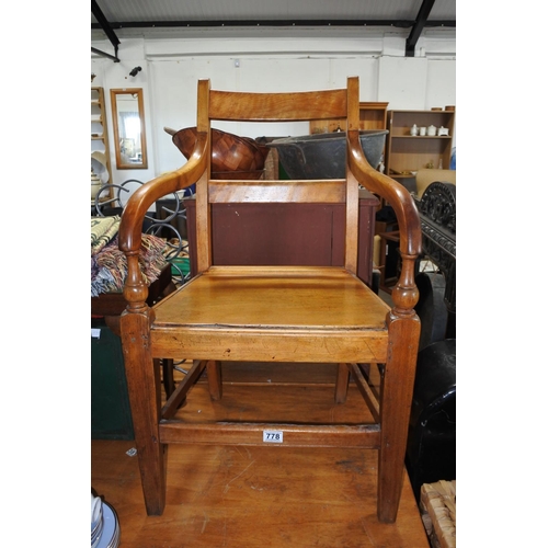 778 - A stunning antique elm carver chair.