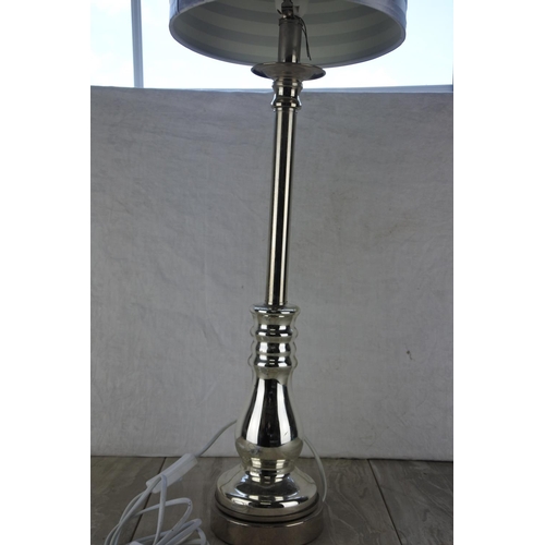 783 - A large metal based table lamp and shade.  Approx 85cm.