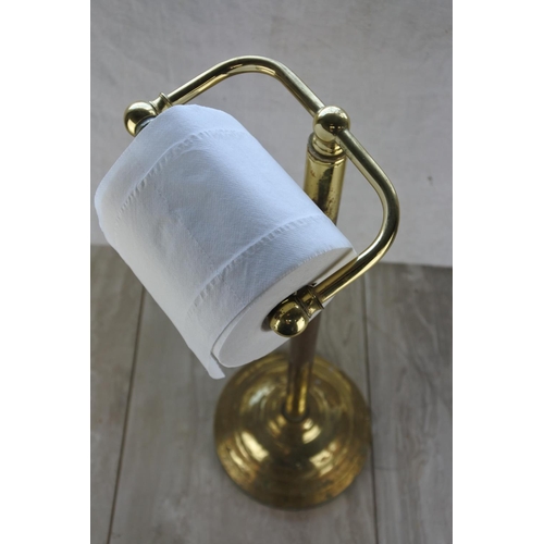 784 - A toilet roll holder.  Approx 57cm.