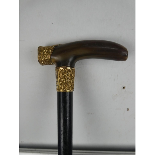 216 - A stunning antique ebony walking cane with horn handle and mounted collar and engraved plaque 'Prese... 