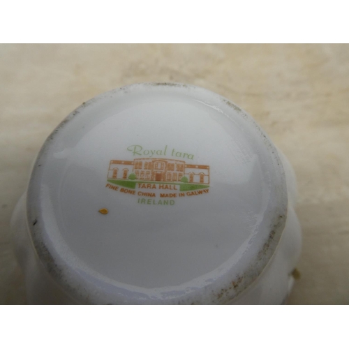 223 - A Royal Tara bone china 'Tara Hall' milk jug and sugar bowl.