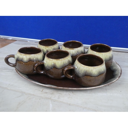 277 - A stunning set of six Portrush Pottery mugs and similar patterned plate.