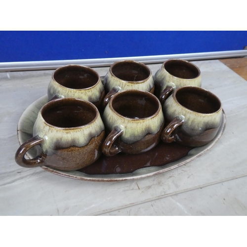 277 - A stunning set of six Portrush Pottery mugs and similar patterned plate.