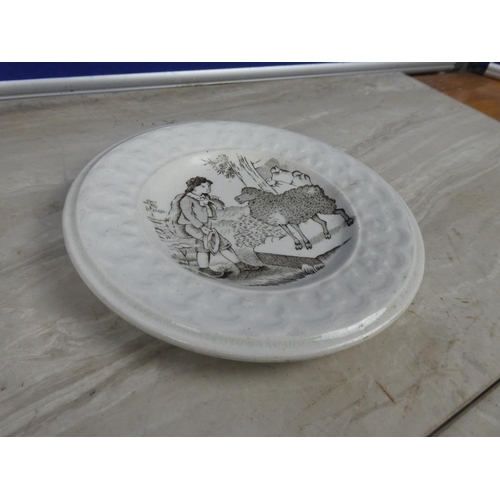 335 - A stunning antique pearlware plate with Shepherd scene. (a/f).