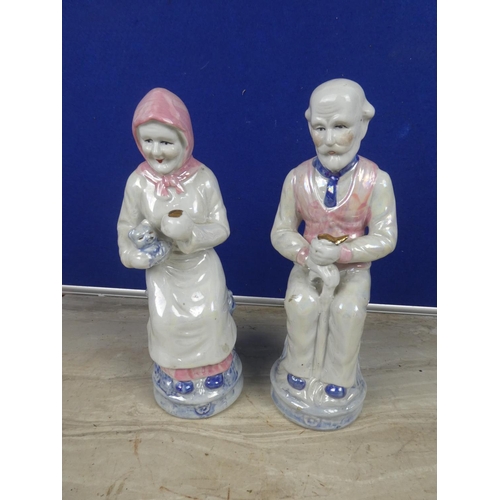 363 - A pair of large ceramic granny & granda figures.  Approx 28cm.