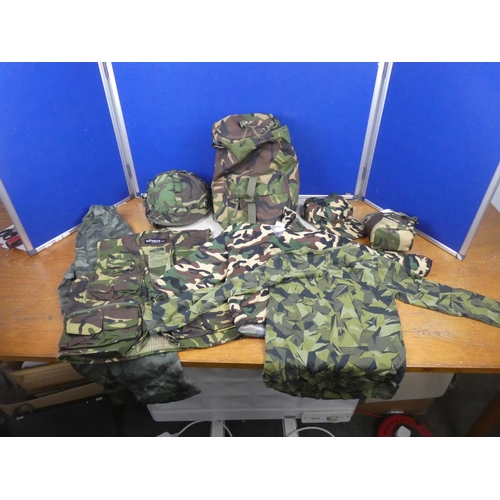 406 - An army camouflage holdall, helmet, water bottle and more.